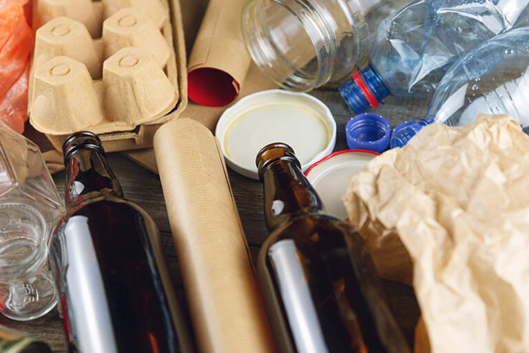 Plastic, glass, metal and paper garbage for recycling concept re